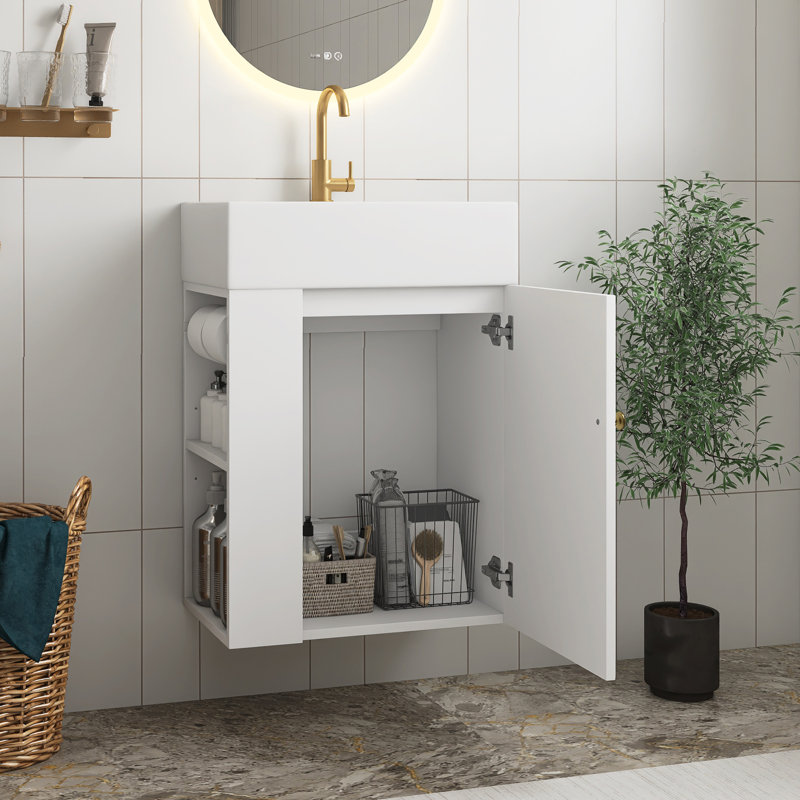 Meuble-lavabo blanc en panneau de fibres à densité moyenne de 20 po avec lavabo en céramique, porte à motif de losanges, poignée dorée et tablettes de rangement latérales avec barre à serviettes