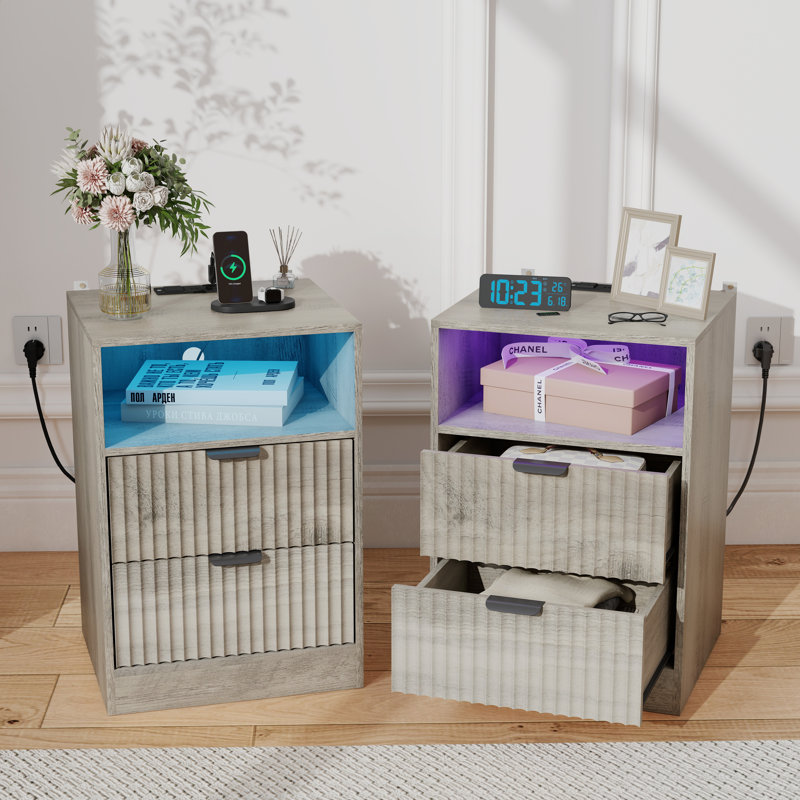 Modern-style nightstand featuring a charging station, RGB LED light strip, and storage space—featuring a grooved wave design with a water-resistant surface.
