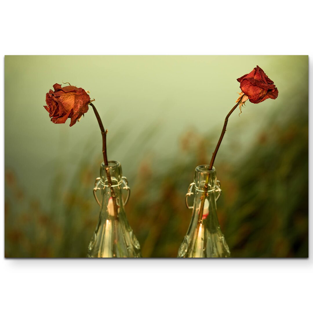 Leinwandbild Getrocknete Rosen beim Sonnenuntergang