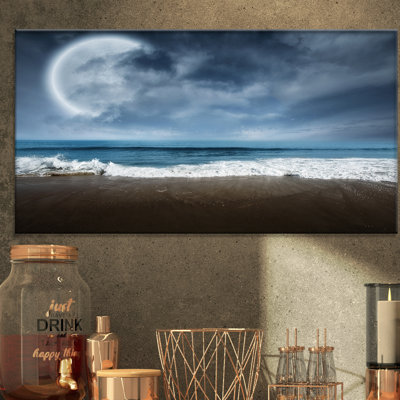 Reproduction de photo sur toile tendue sous la pleine lune calme océan