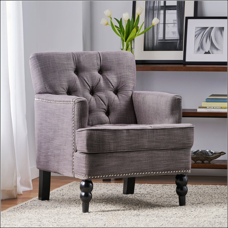 Fauteuil club capitonné