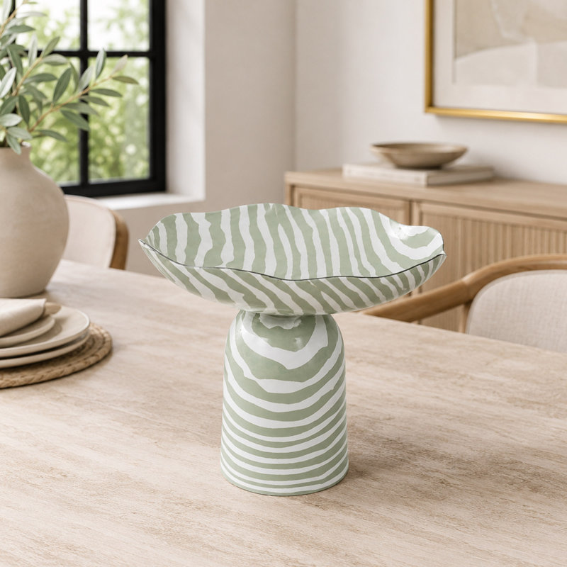 Bol décoratif rayé en métal avec base piédestal