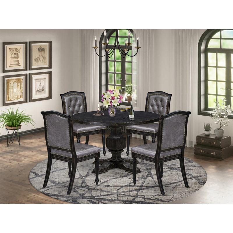 L'ensemble de table 5 pièces comprend une table ronde de style Mid-Century et 4 chaises en polyester texturé brun avec dossier haut, finition noire sablée.