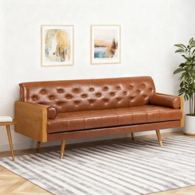 Mid-Century Modern Tufted Sofa with Rolled Accent Pillows, Combining Elegance and Comfort for a Stylish Living Room Upgrade.