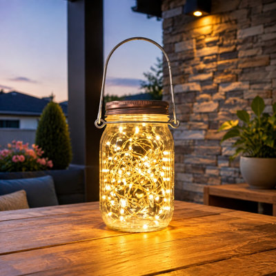 This 8 Pack of lightweight, break-resistant plastic solar mason jars contains 30 LED lights; Jars and Hangers Included, with waterproof hanging use on patios, gardens, porches, yards, backyards, or balconies in Warm White.