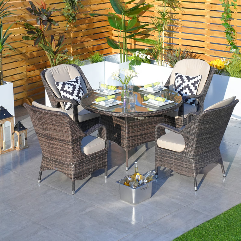 4 - Person Patio Dining Set with Oval Table , Cushions Included, Brown/Beige