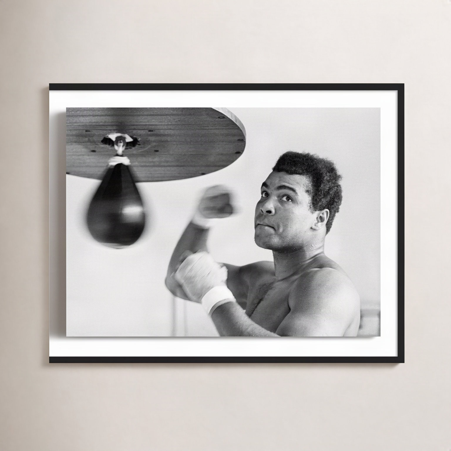 Muhammad Ali Punching Bag by Getty Images, 30" H x 40" W, Black Maple Framed