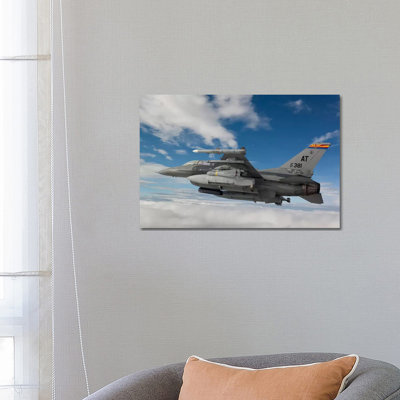 F-16 Fighting Falcon Flies With An AGM-65 Maverick Missile by HIGH-G Productions - Wrapped Canvas Print