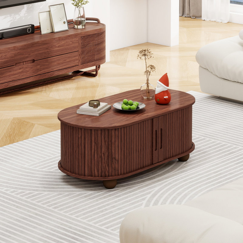 Table basse 39,98 "ovale avec rangement et portes à tambour coulissantes à 360 °