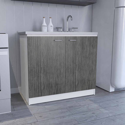Évier utilitaire avec armoire, une étagère, armoire à deux portes