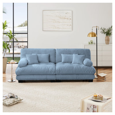 Causeuse 2 places en chenille bleue avec coussins pour le salon