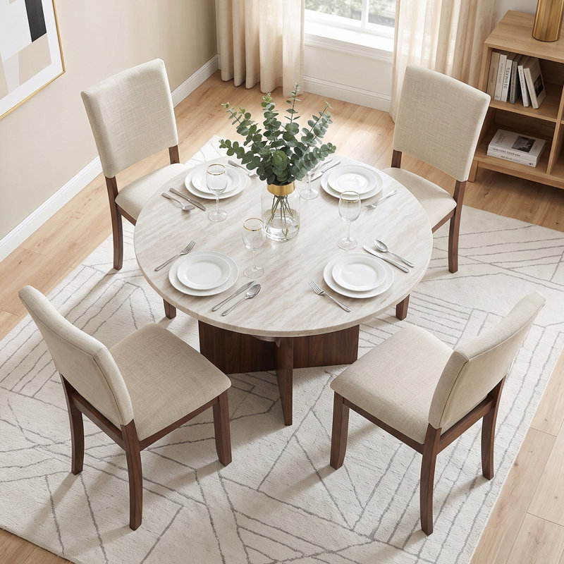 Ensemble de table et de chaises de salle à manger transitionnelles pour 4 personnes, comprenant une table ronde et 4 chaises de salle à manger rembourrées.
