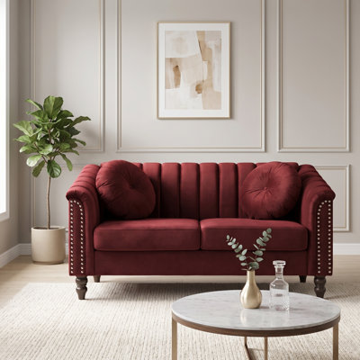 Red Upholstered Loveseat with Channel Tufting, Rolled Arms and Nailhead Trim