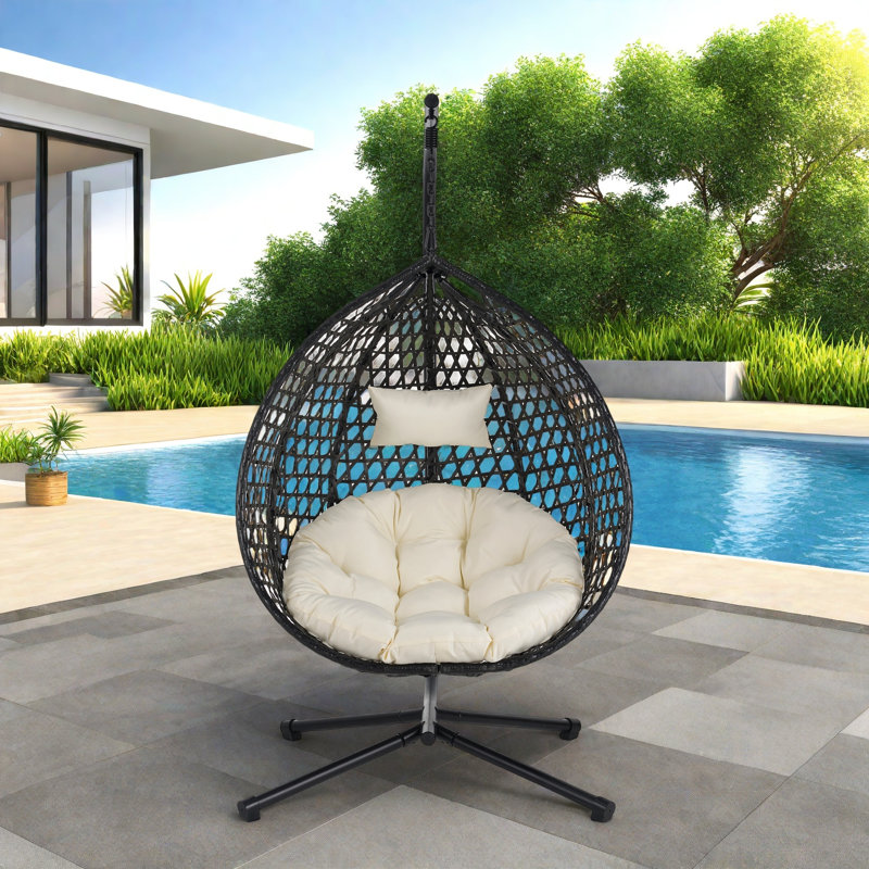 Fauteuil à œufs suspendu polyvalent avec motif en rotin évidé Pe, base en fer, appui-tête et coussin