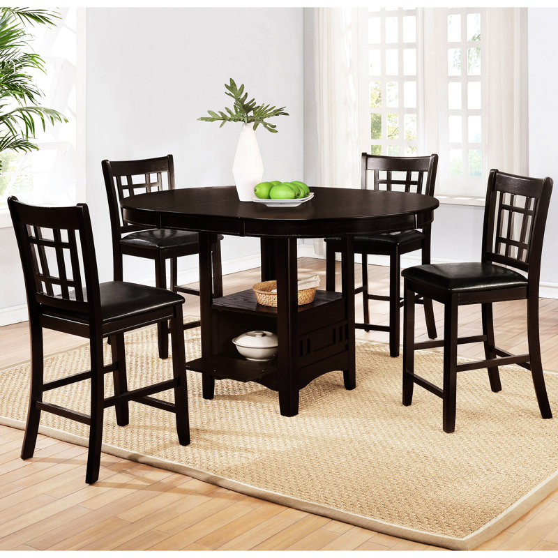 Ensemble de salle à manger avec table ronde extensible, tabourets noirs et piètement central, rangements ouverts et fermés, forme ovale, finition soignée, pour une utilisation pratique.
