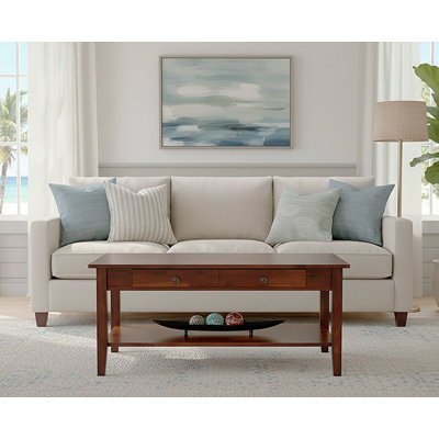 Table basse à 4 pieds en bois massif avec rangement Ambrianna