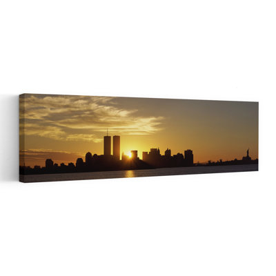 Manhattan Skyline And A Statue At Sunrise Statue Of Liberty New York City New York State USA by Richard Sisk - Wrapped Canvas Panoramic Print