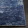 Tapis bleu / blanc à motif abstrait Mcelroy