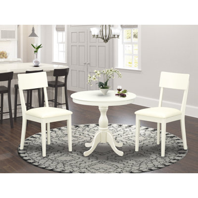 3 Piece Dining Room Furniture Set Contains a Round Kitchen Table with Pedestal and 2 Faux Leather Dining Chairs, Linen White