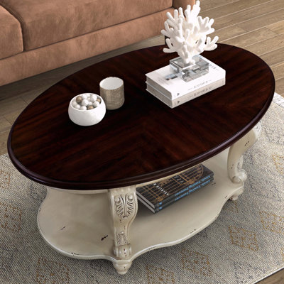 Table basse ovale en bois avec tablette de rangement ouverte