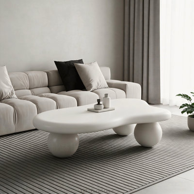 47 Inch Cloud Shaped Coffee Table with 3 Ball Legs, Cream White