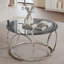 Table basse moderne Ã  plateau rond en verre et structure mÃ©tallique circulaire-577139594-577139599