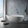 69.3"L x 33.5"W x 21.7"H Solid Surface Freestanding Oval Tub with Overflow and Drain
