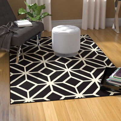 Tapis noir et blanc à motif géométrique