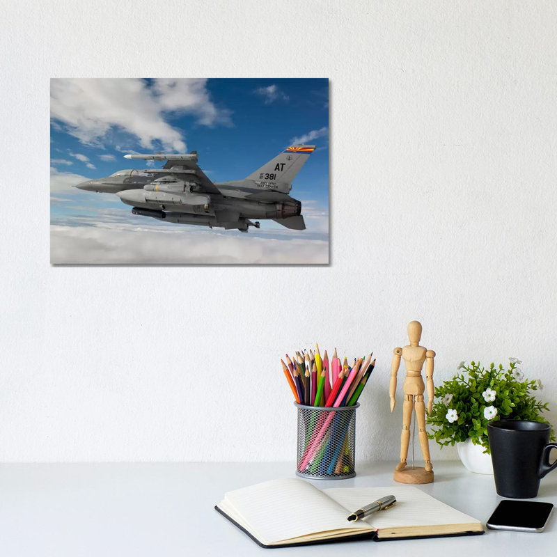 F-16 Fighting Falcon Flies With An AGM-65 Maverick Missile by HIGH-G Productions - Wrapped Canvas Print