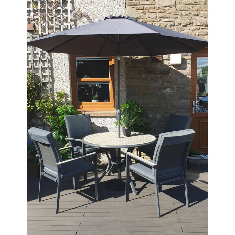 VanVleet 4 - Person Patio Dining Set Umbrella Hole Included Round Table with Cushions Included