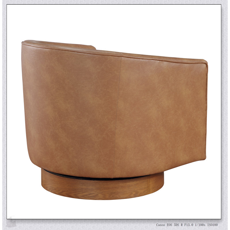 Fauteuil pivotant demi-tonneau en similicuir Maisy