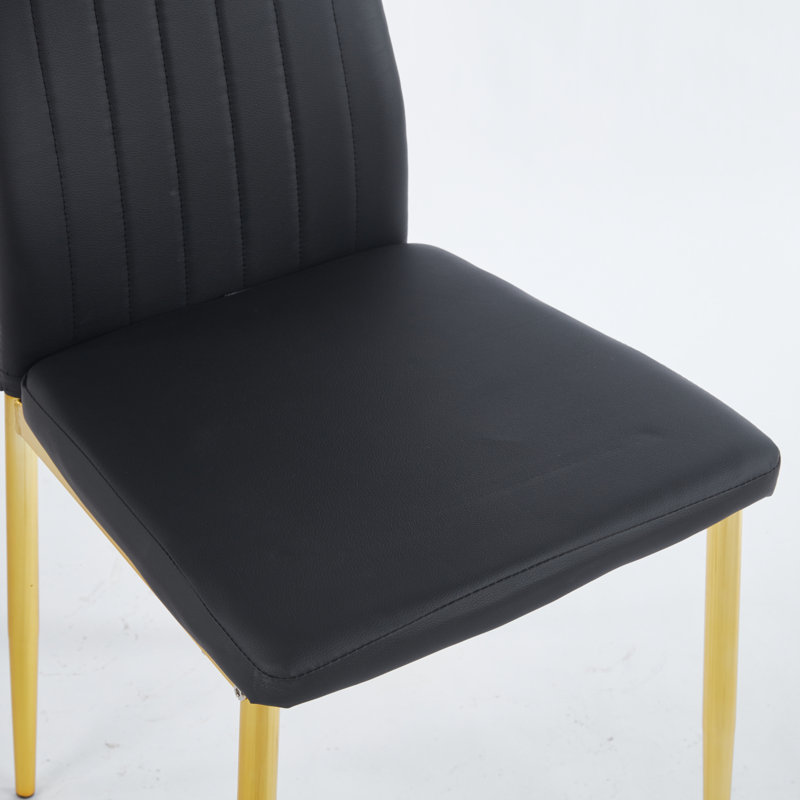 Ensemble de quatre chaises de salle à manger confortables au savoir-faire exquis, idéales pour améliorer votre expérience culinaire et ajouter de l'élégance à votre espace.