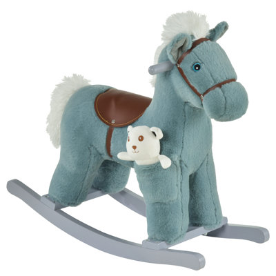 On Rocking Horse With Bear Toy
