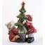 Child statue with illuminated Christmas tree