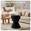 Repose-pieds rond en velours noir avec silhouette de tambour