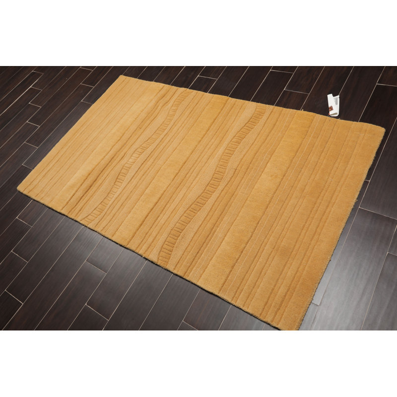 Tapis jaune en laine touffeté