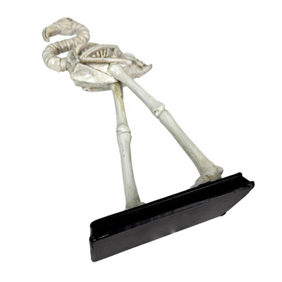 Eclectic distressed off-white resin flamingo skeleton statue with black base, 12 inches high
