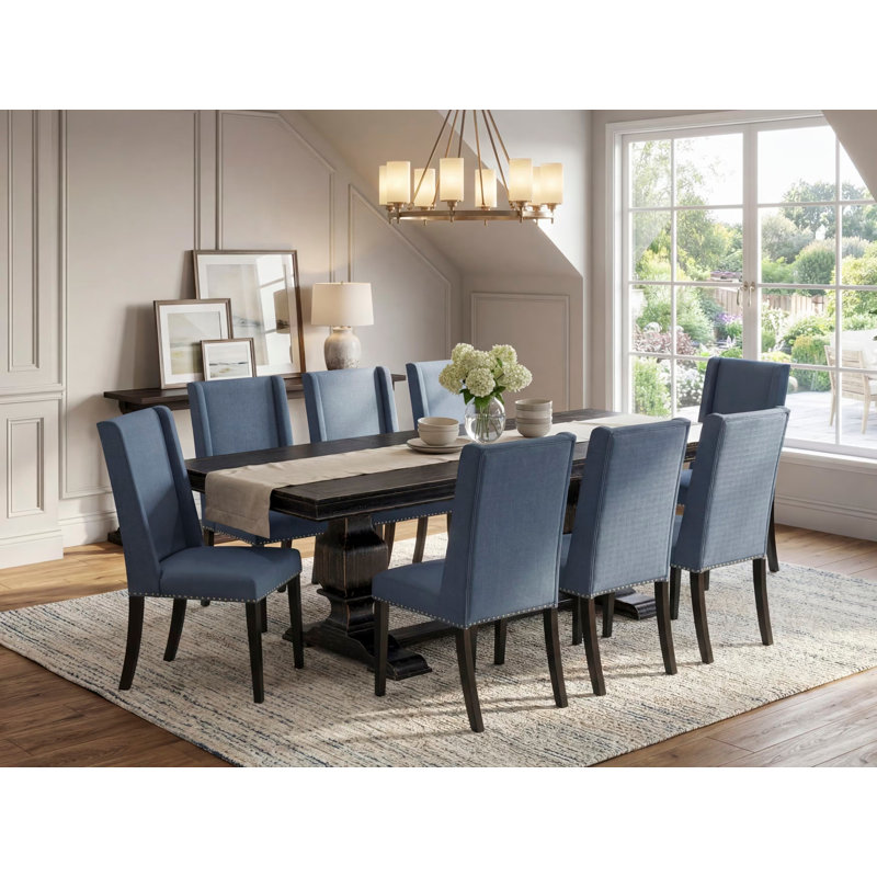 Cet ensemble de table à manger 9 pièces comprend une table de salle à manger et 8 chaises de cuisine en tissu de lin bleu minéral avec dossier rembourré - finition noire sablée.