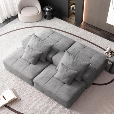 Canapé modulaire capitonné en chenille avec 2 repose-pieds et coussins Lora