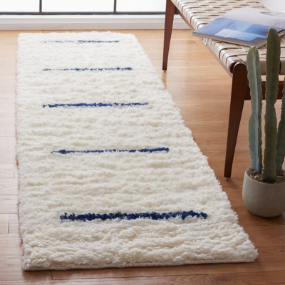 Tapis ivoire / bleu marine en laine fait à la main Mayer