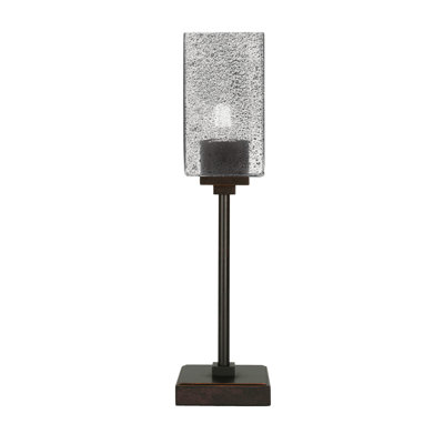 Lampe d'appoint Luna présentée en finition granit foncé avec verre à bulles fumée carré de 3,5 po