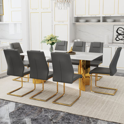 Table en verre avec autocollants en marbre et pieds dorés en acier inoxydable le long gris foncé - Chaises rembourrées en métal à 8 places pour les fêtes de famille