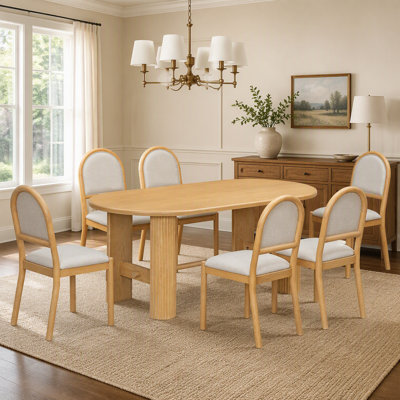 Ensemble de salle à manger ovale 7 pièces avec 6 chaises rembourrées et un pied central en bois cannelé, idéal pour des repas de famille et des réunions élégantes.
