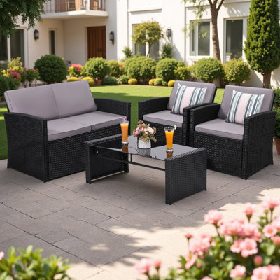 Ensemble de patio modulaire en osier 4 pièces avec coussins et table en verre 4 pièces