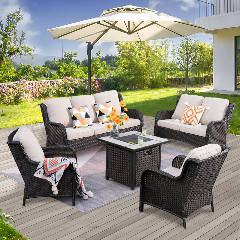 Klodjana Premium All-Weather Wicker 7 - Person Patio Conversation Set with Cushions, Brown, Navy Blue