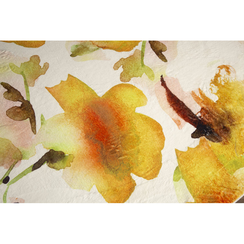 Tapis orange et jaune à motif floral