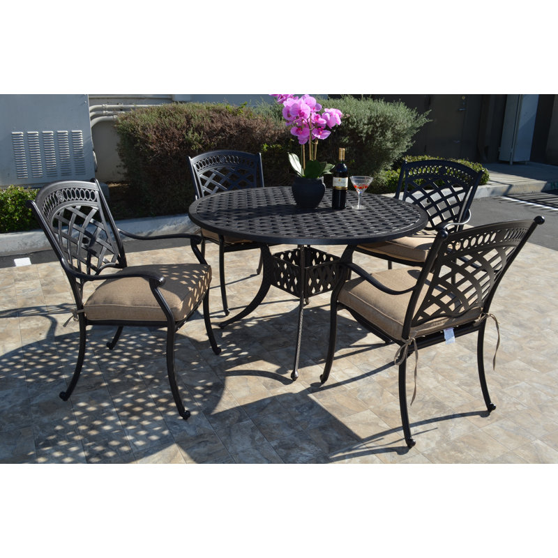 Wildermuth 4 - Person Patio Dining Set with Round Table , Sunbrella® Cushions Included