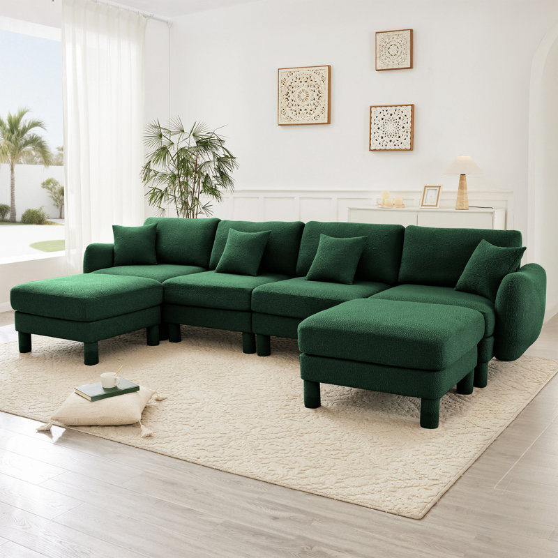 Canapé modulaire en tissu Boucle avec accoudoirs distinctifs et repose-pieds mobile