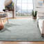 Tapis bleu clair en laine touffeté à la main Moniz-126321377