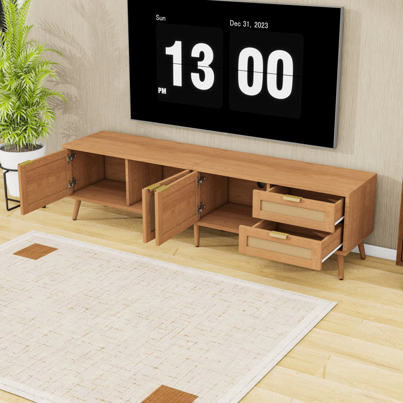 Meuble télé moderne avec portes d'armoire en rotin, 2 tiroirs, trous de câbles et pieds robustes